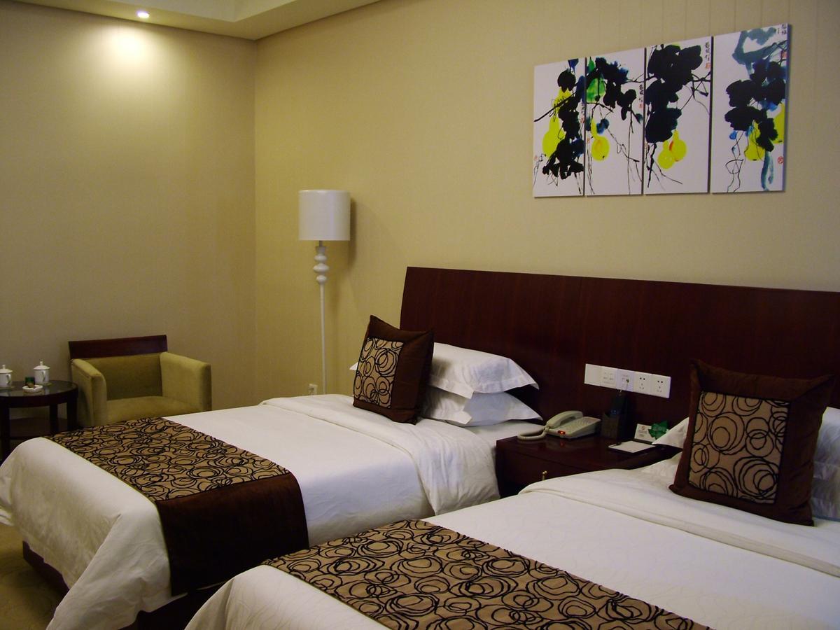 Fuxing Oriental Boutique Hotel Chifeng Quarto foto