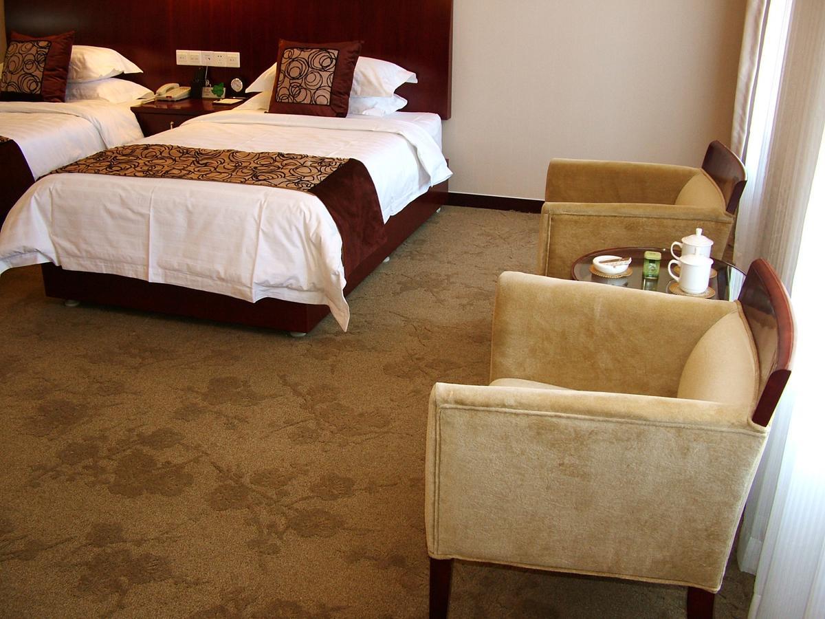 Fuxing Oriental Boutique Hotel Chifeng Quarto foto